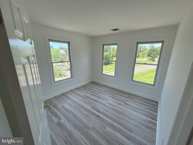 6325 Powder Flask Ct, Centreville, VA 20121 - spare room with healthy amount of natural light, wood finished floors, and baseboards