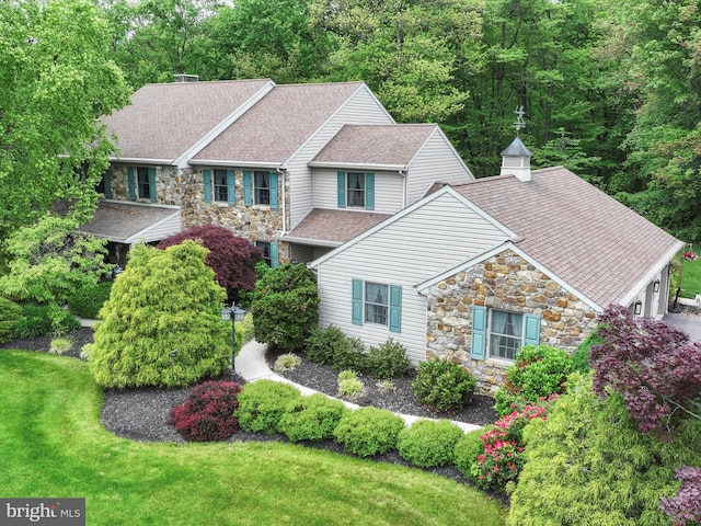 3622 Pricetown Rd, Fleetwood, PA 19522 - craftsman house featuring stone siding, roof with shingles, a front yard, and an attached garage