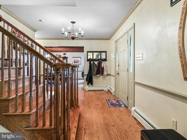 3622 Pricetown Rd, Fleetwood, PA 19522 - entryway featuring a chandelier, wood finished floors, baseboard heating, ornamental molding, and stairs