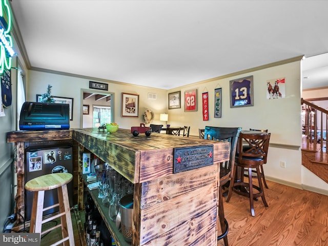 3622 Pricetown Rd, Fleetwood, PA 19522 - bar area with wood finished floors, stairway, crown molding, and baseboards