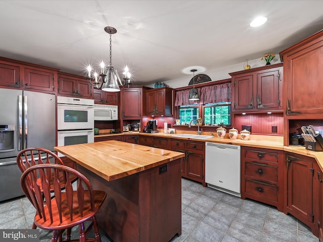 3622 Pricetown Rd, Fleetwood, PA 19522 - kitchen featuring white appliances, a sink, wooden counters, a chandelier, and pendant lighting