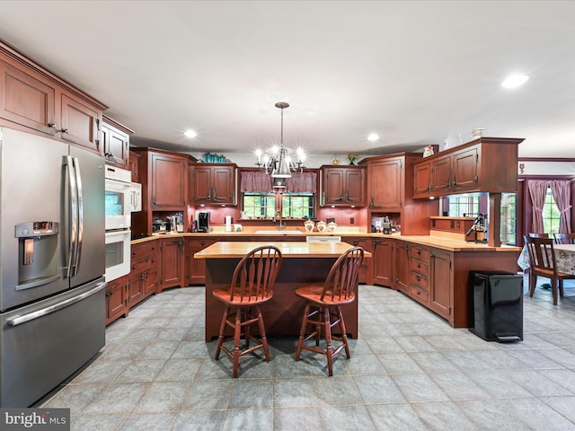 3622 Pricetown Rd, Fleetwood, PA 19522 - kitchen featuring stainless steel fridge with ice dispenser, a sink, light countertops, a center island, and recessed lighting