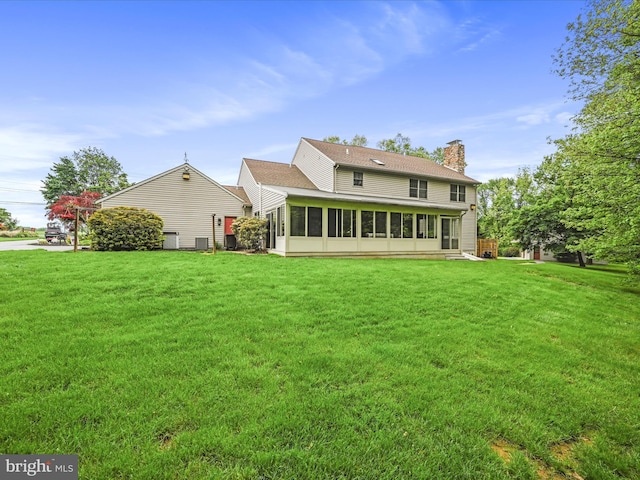 3622 Pricetown Rd, Fleetwood, PA 19522 - rear view of house featuring a chimney, a sunroom, and a lawn