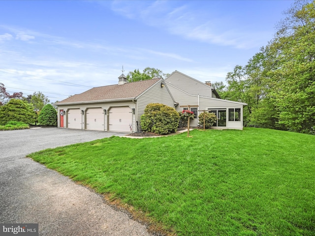 3622 Pricetown Rd, Fleetwood, PA 19522 - view of front facade featuring a chimney, asphalt driveway, a front yard, and a garage