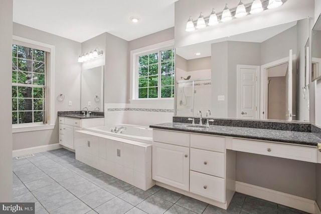 5257 Ferry Branch Ln, Lothian, MD 20711 - bathroom with a bath, a shower stall, healthy amount of natural light, and vanity