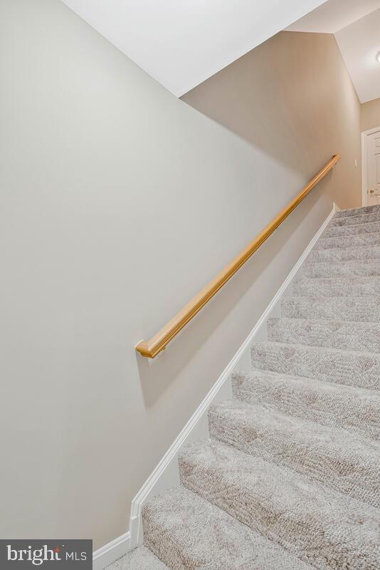 5257 Ferry Branch Ln, Lothian, MD 20711 - stairs with baseboards and carpet flooring