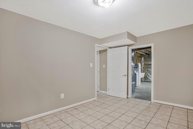 5257 Ferry Branch Ln, Lothian, MD 20711 - unfurnished room featuring baseboards and light tile patterned floors
