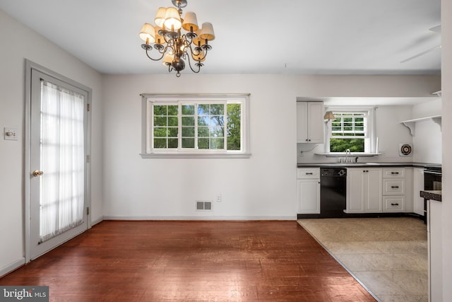807 Fulton Pl, Woodbridge, VA 22191 - kitchen with dishwasher, plenty of natural light, a sink, and wood finished floors