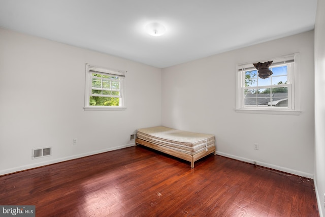807 Fulton Pl, Woodbridge, VA 22191 - unfurnished bedroom featuring wood finished floors and baseboards