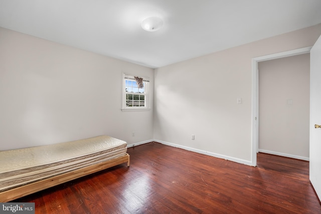 807 Fulton Pl, Woodbridge, VA 22191 - unfurnished bedroom with wood finished floors and baseboards