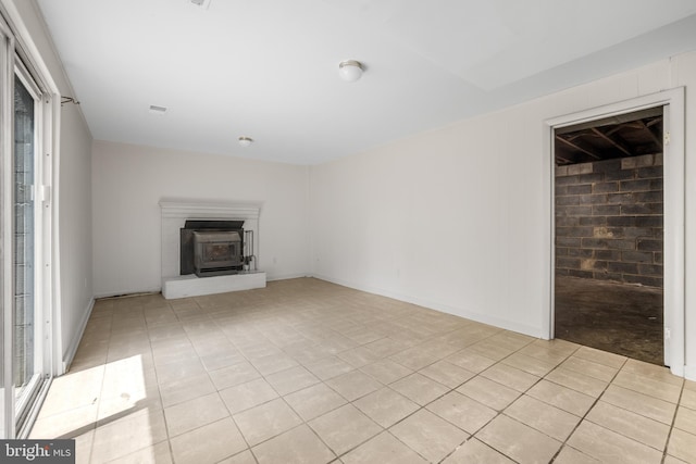 807 Fulton Pl, Woodbridge, VA 22191 - unfurnished living room featuring light tile patterned floors and a wood stove