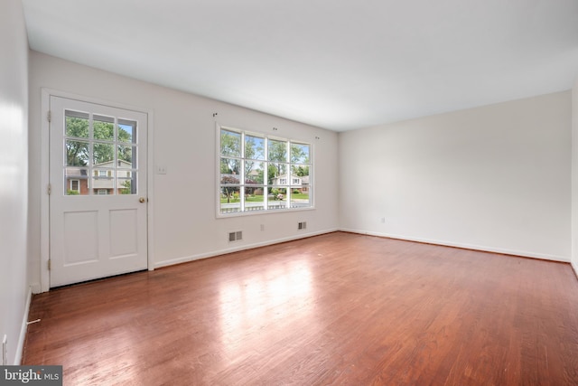 807 Fulton Pl, Woodbridge, VA 22191 - spare room with healthy amount of natural light, wood finished floors, and baseboards