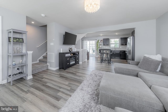 33 Burr St, Williamstown, NJ 08094 - living room with stairs, light wood-style floors, baseboards, a chandelier, and recessed lighting