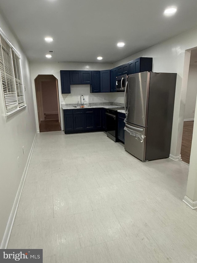 40775 Kennedy Ct, Mechanicsville, MD 20659 - kitchen with stainless steel appliances, baseboards, light countertops, a sink, and recessed lighting