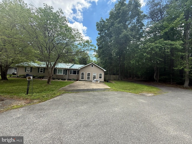 40775 Kennedy Ct, Mechanicsville, MD 20659 - view of front of property featuring driveway, a front lawn, and metal roof