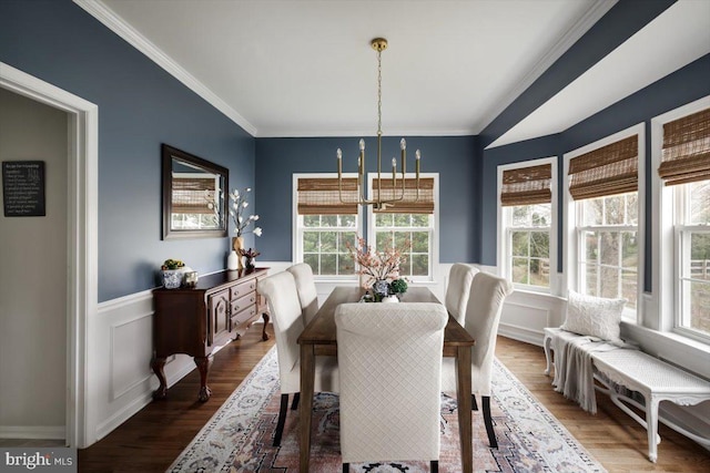 47 Orleans Dr, Shepherdstown, WV 25443 - dining area with a chandelier, ornamental molding, wood finished floors, and wainscoting