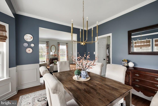 47 Orleans Dr, Shepherdstown, WV 25443 - dining area with a chandelier, ornamental molding, wood finished floors, and a wainscoted wall