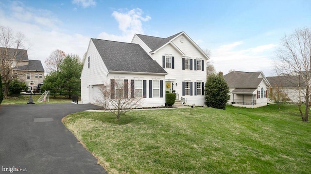 47 Orleans Dr, Shepherdstown, WV 25443 - view of front of house featuring a garage, asphalt driveway, a front lawn, and a shingled roof