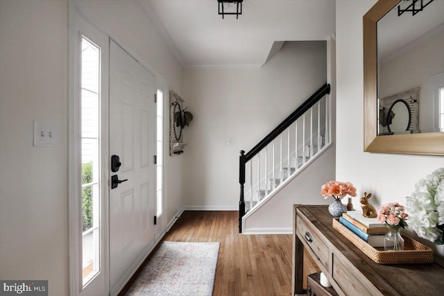 47 Orleans Dr, Shepherdstown, WV 25443 - entryway with stairs, wood finished floors, ornamental molding, and baseboards