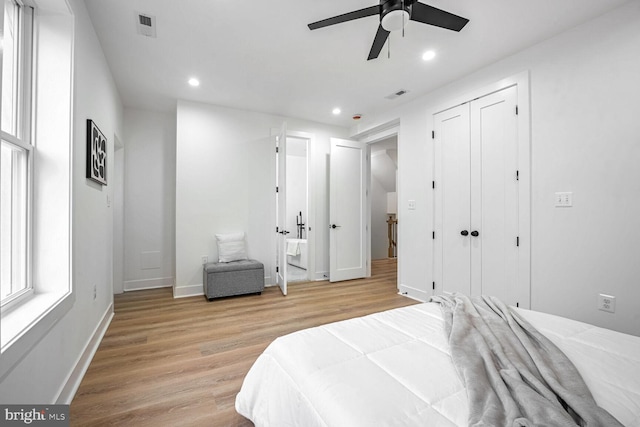 bedroom with light wood-style floors, baseboards, recessed lighting, and a ceiling fan