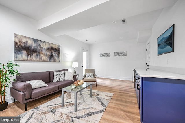 living room with light wood-style floors and baseboards