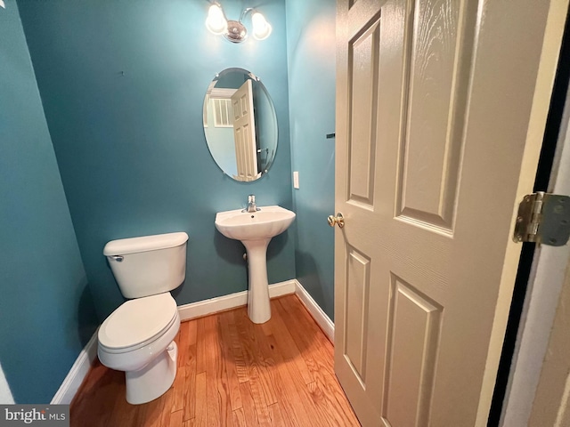126 Greenway St, Fredericksburg, VA 22405 - bathroom featuring wood finished floors, toilet, baseboards, and a sink