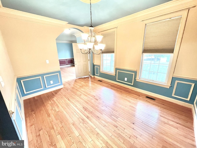 126 Greenway St, Fredericksburg, VA 22405 - spare room featuring a chandelier, ornamental molding, hardwood / wood-style flooring, a wainscoted wall, and arched walkways