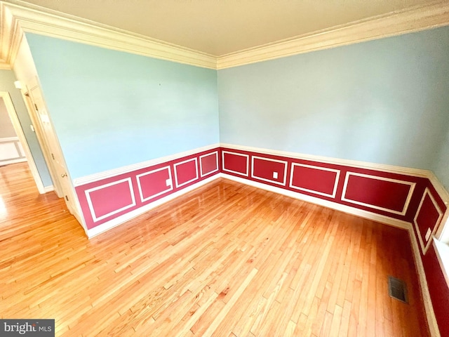 126 Greenway St, Fredericksburg, VA 22405 - unfurnished room with ornamental molding, wood-type flooring, a wainscoted wall, and a decorative wall