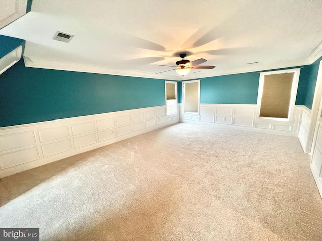 126 Greenway St, Fredericksburg, VA 22405 - unfurnished room featuring a decorative wall, crown molding, carpet floors, ceiling fan, and wainscoting