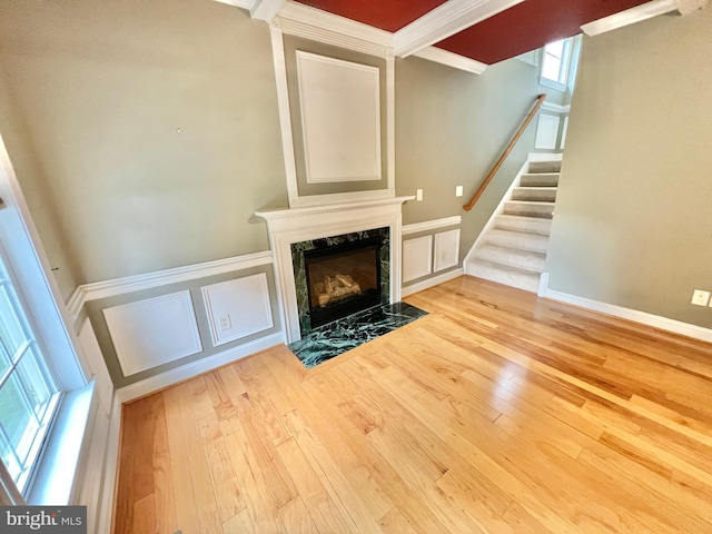 126 Greenway St, Fredericksburg, VA 22405 - unfurnished living room with hardwood / wood-style floors, crown molding, a premium fireplace, stairway, and a decorative wall