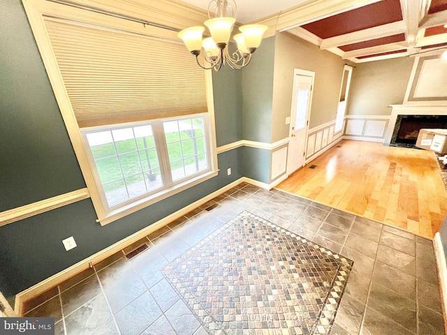126 Greenway St, Fredericksburg, VA 22405 - unfurnished living room featuring a chandelier, beam ceiling, a wainscoted wall, baseboards, and crown molding