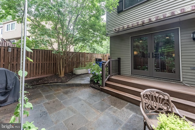 7414 Golden Horseshoe Ct, Springfield, VA 22153 - fenced backyard with french doors, grilling area, and a patio
