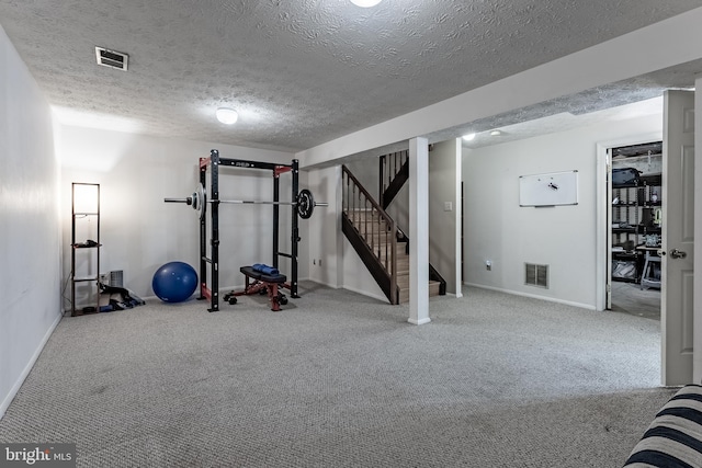 7414 Golden Horseshoe Ct, Springfield, VA 22153 - exercise room featuring carpet floors and a textured ceiling