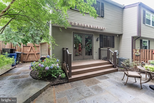 7414 Golden Horseshoe Ct, Springfield, VA 22153 - view of exterior entry featuring french doors, a patio, and a gate