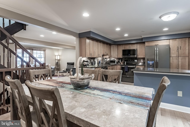 7414 Golden Horseshoe Ct, Springfield, VA 22153 - dining room with crown molding, stairs, recessed lighting, and light wood-type flooring