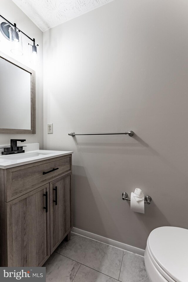 7414 Golden Horseshoe Ct, Springfield, VA 22153 - bathroom featuring vanity and toilet