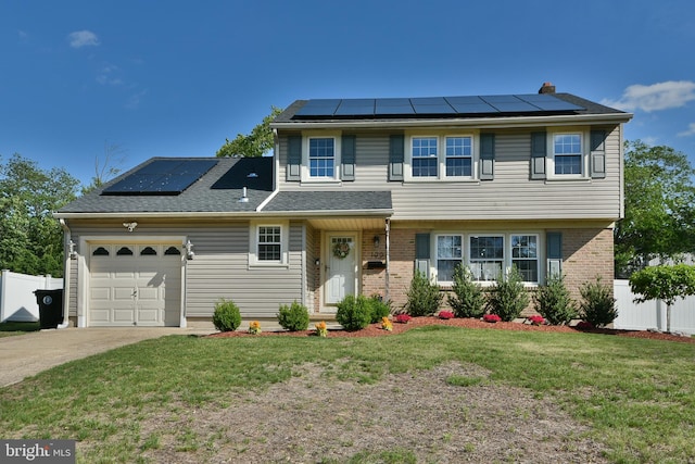 100 Shenandoah Rd, Cinnaminson, NJ 08077 - view of front of property with solar panels, a garage, driveway, brick siding, and a chimney