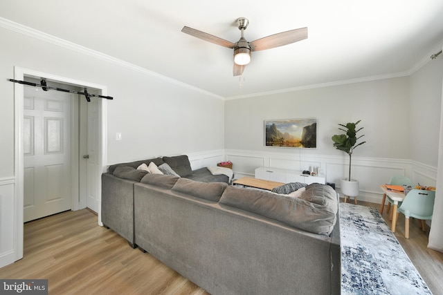 100 Shenandoah Rd, Cinnaminson, NJ 08077 - living area featuring light wood-type flooring, ornamental molding, a ceiling fan, and a wainscoted wall
