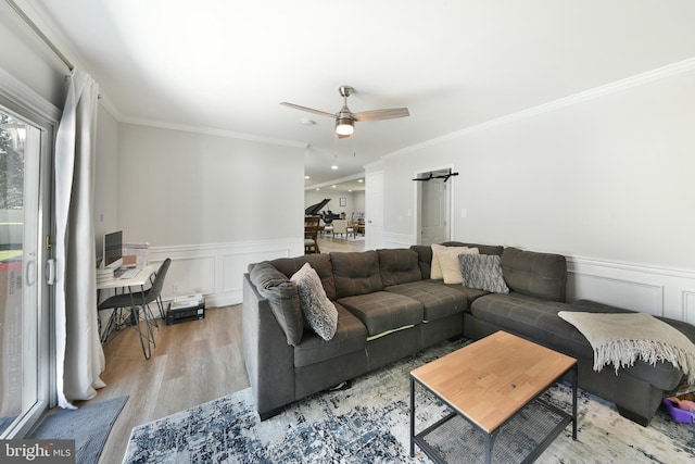 100 Shenandoah Rd, Cinnaminson, NJ 08077 - living area featuring ornamental molding, ceiling fan, wood finished floors, wainscoting, and a desk