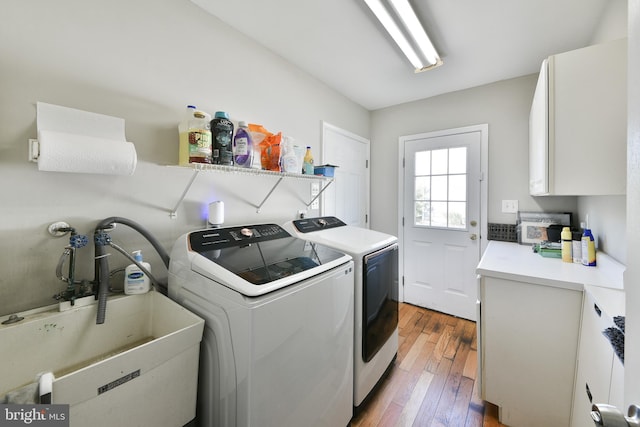 100 Shenandoah Rd, Cinnaminson, NJ 08077 - laundry area featuring independent washer and dryer, hardwood / wood-style floors, and cabinet space