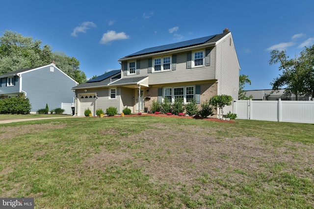 100 Shenandoah Rd, Cinnaminson, NJ 08077 - view of front of home with solar panels, an attached garage, a chimney, and brick siding