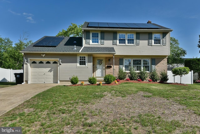 100 Shenandoah Rd, Cinnaminson, NJ 08077 - view of front facade featuring roof mounted solar panels, a garage, concrete driveway, and brick siding