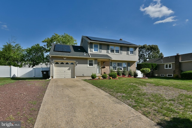 100 Shenandoah Rd, Cinnaminson, NJ 08077 - view of front facade with solar panels, a garage, concrete driveway, and brick siding