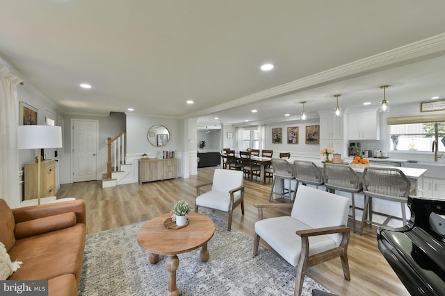 100 Shenandoah Rd, Cinnaminson, NJ 08077 - living area featuring crown molding, stairway, light wood-type flooring, recessed lighting, and wainscoting
