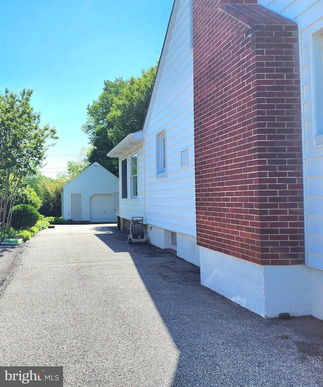 9109 Carlisle Ave, Baltimore, MD 21236 - view of home's exterior with a garage and an outdoor structure