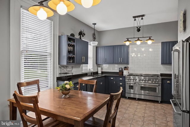 100 W Maple Ave, Merchantville, NJ 08109 - kitchen featuring stainless steel appliances, dark countertops, a sink, and decorative backsplash