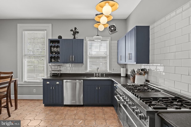 100 W Maple Ave, Merchantville, NJ 08109 - kitchen with appliances with stainless steel finishes, dark countertops, a sink, and healthy amount of natural light