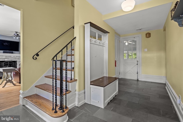 100 W Maple Ave, Merchantville, NJ 08109 - mudroom with ceiling fan, baseboards, dark tile patterned floors, and a fireplace