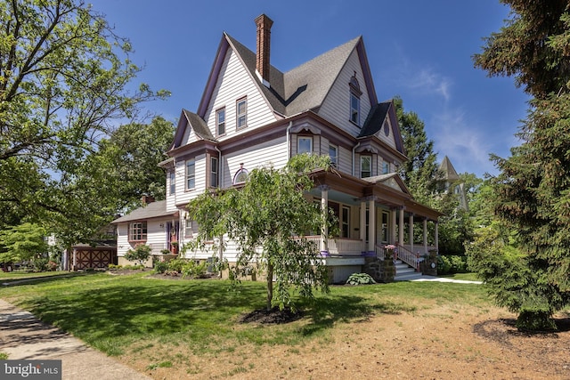 100 W Maple Ave, Merchantville, NJ 08109 - view of side of property featuring a porch, a yard, and a chimney