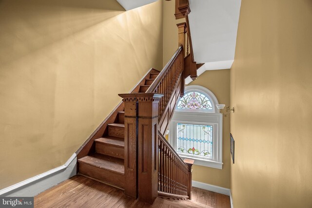 100 W Maple Ave, Merchantville, NJ 08109 - stairway featuring wood finished floors, a high ceiling, and baseboards